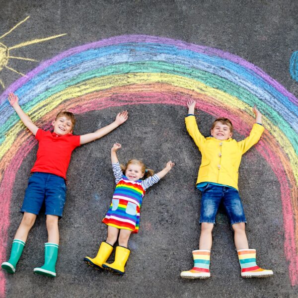 Children and rainbow chalk drawing